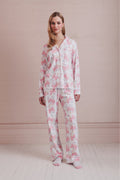 Women's long-sleeve pajama set in pink-and-white bow print, button-front top and pants