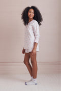 Girls' long-sleeve pajama top with pastel heart print and matching shorts