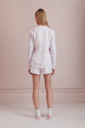 Girls' pajama set with pastel heart print, back view of long-sleeve top and shorts