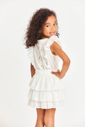 Girls white tiered ruffle dress, angled front view with gathered sleeveless top