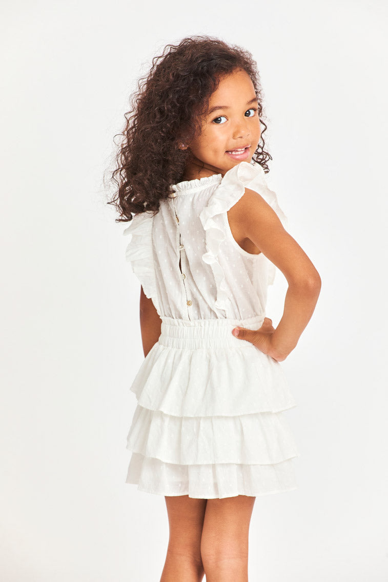 Girls white tiered ruffle dress, angled front view with gathered sleeveless top