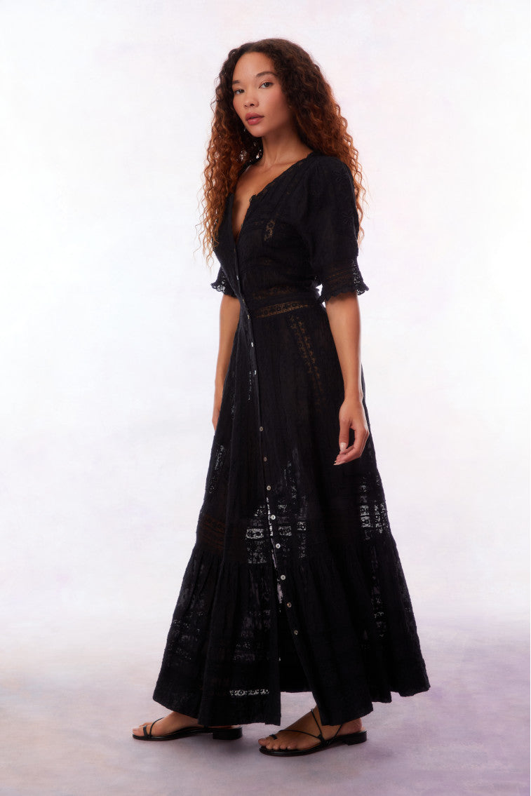 Black button-front maxi dress with V-neck, tiered skirt, and lace-like trim