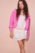 Girls pink alpaca bow button cardigan with V-neck and chest bow detail