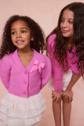 Girls pink alpaca bow button cardigan with chest bow and ribbed trim