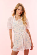 Light blue toile print apron with bib front, waist tie, and lace-edged hem