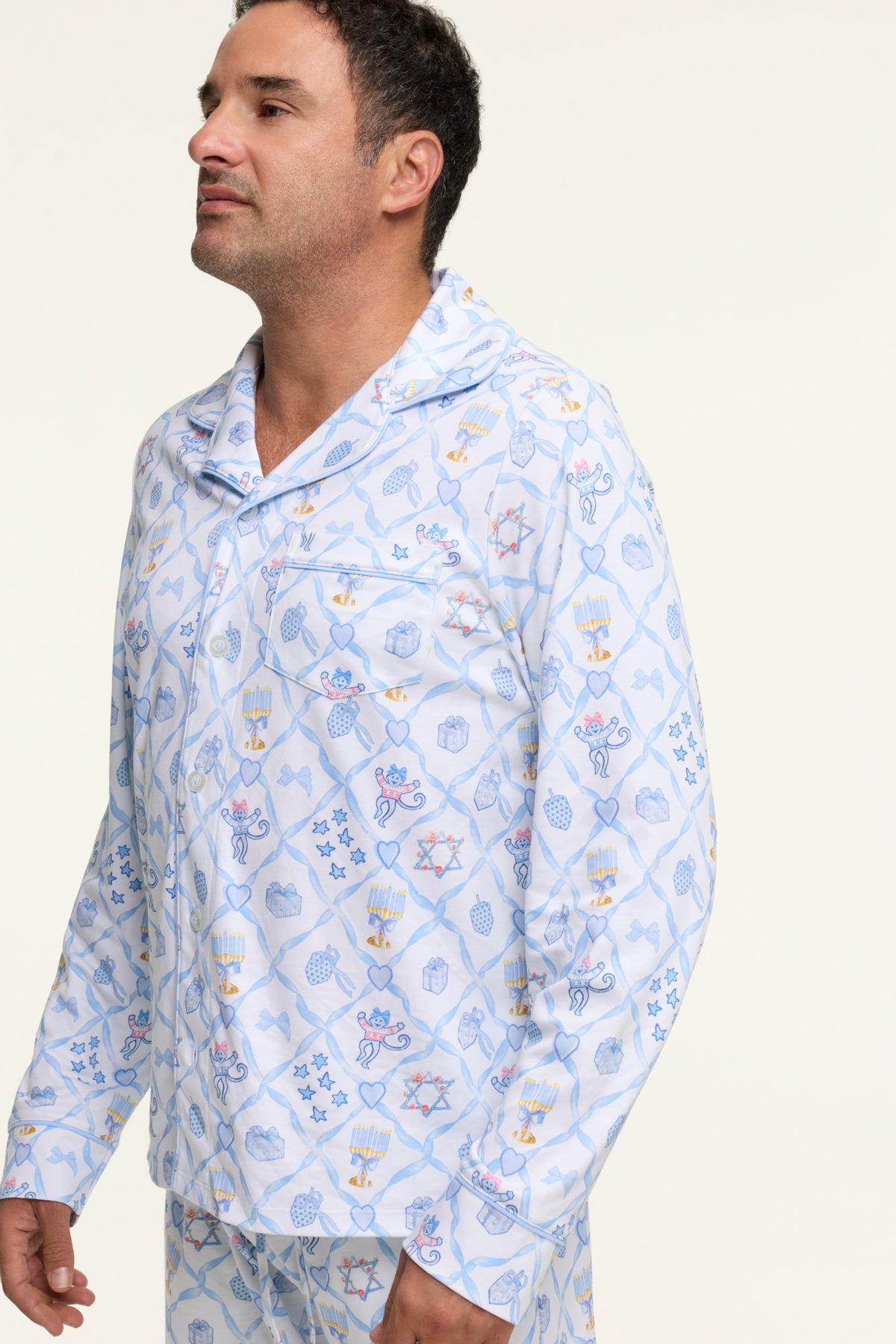 Men's blue patterned pajama shirt with button-front and long sleeves, side view