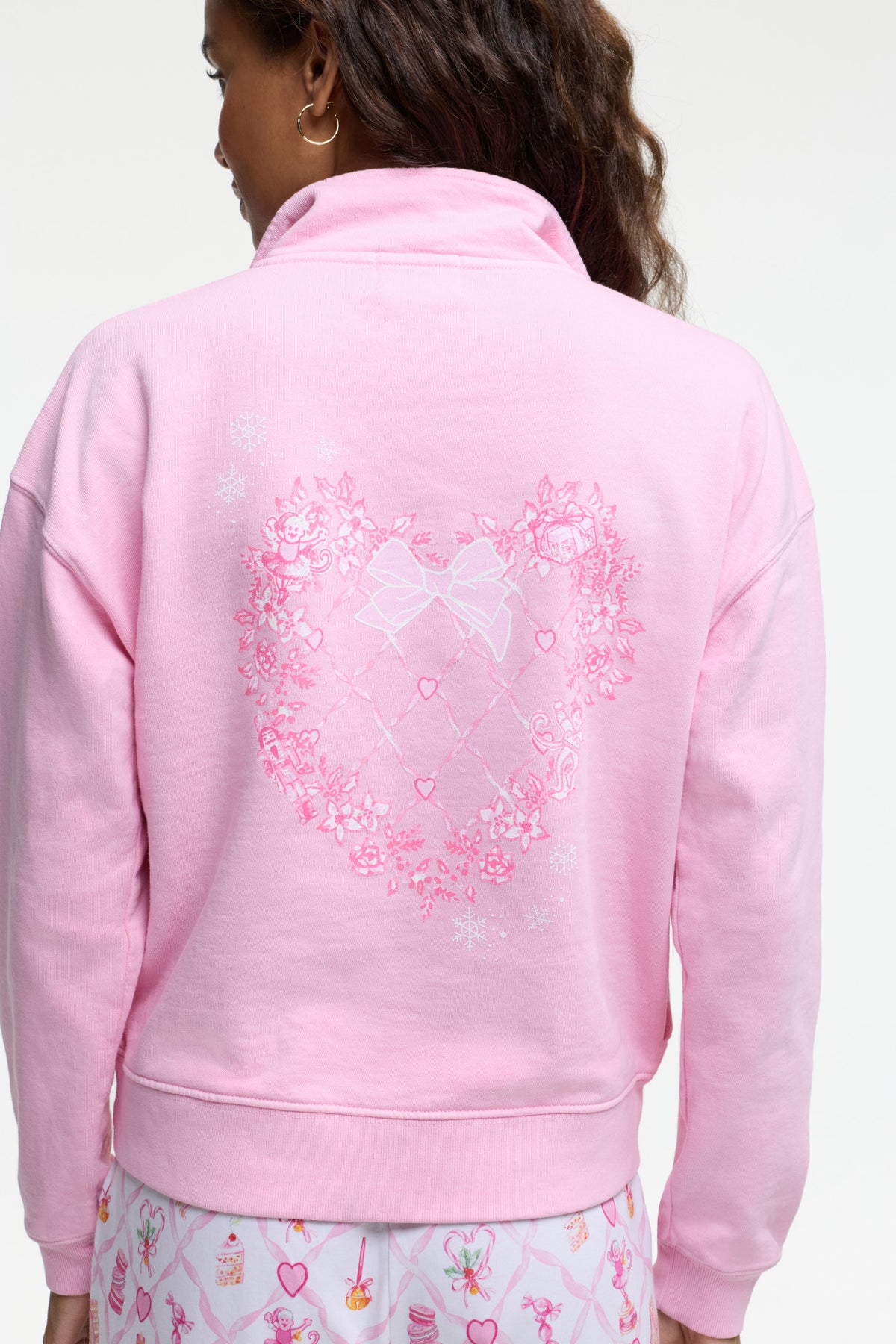 Pink half-zip sweatshirt with large back heart lattice graphic and ribbed hem