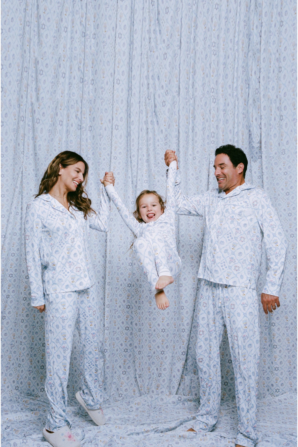 Men's blue patterned long-sleeve pajama set with open collar and relaxed pants