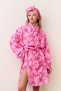 Pink cotton bath robe with bow print, tie belt and hood with knotted bow