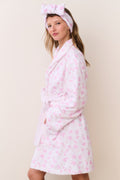 Pink floral cotton bathrobe with tie belt and shawl collar, side view on model