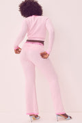 Pink ribbed knit flare pants with foldover waistband, wide leg