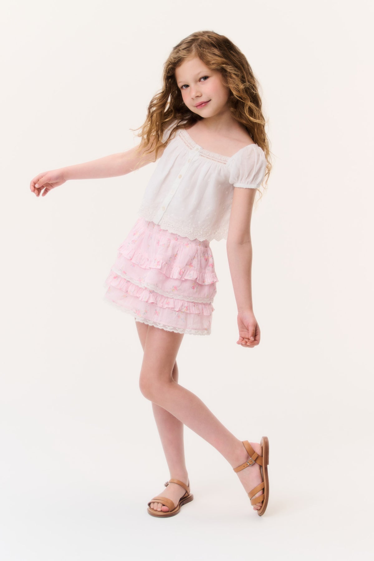 Girls light pink tiered ruffle mini skirt with elastic waistband