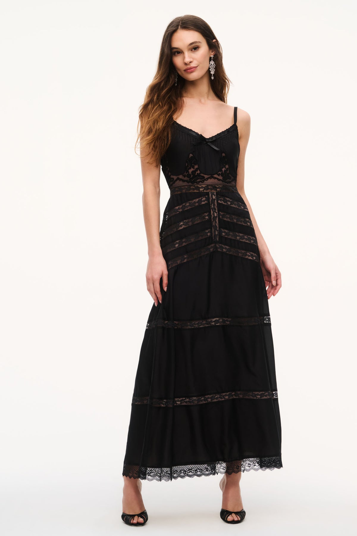 Black lace maxi dress with spaghetti straps, scoop neckline, and tiered lace hem