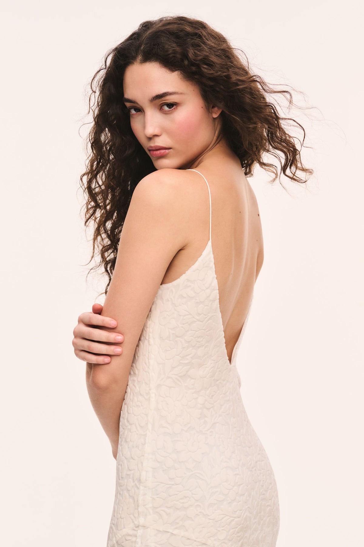 White burnout velvet maxi dress with lace-like burnout texture and V-back