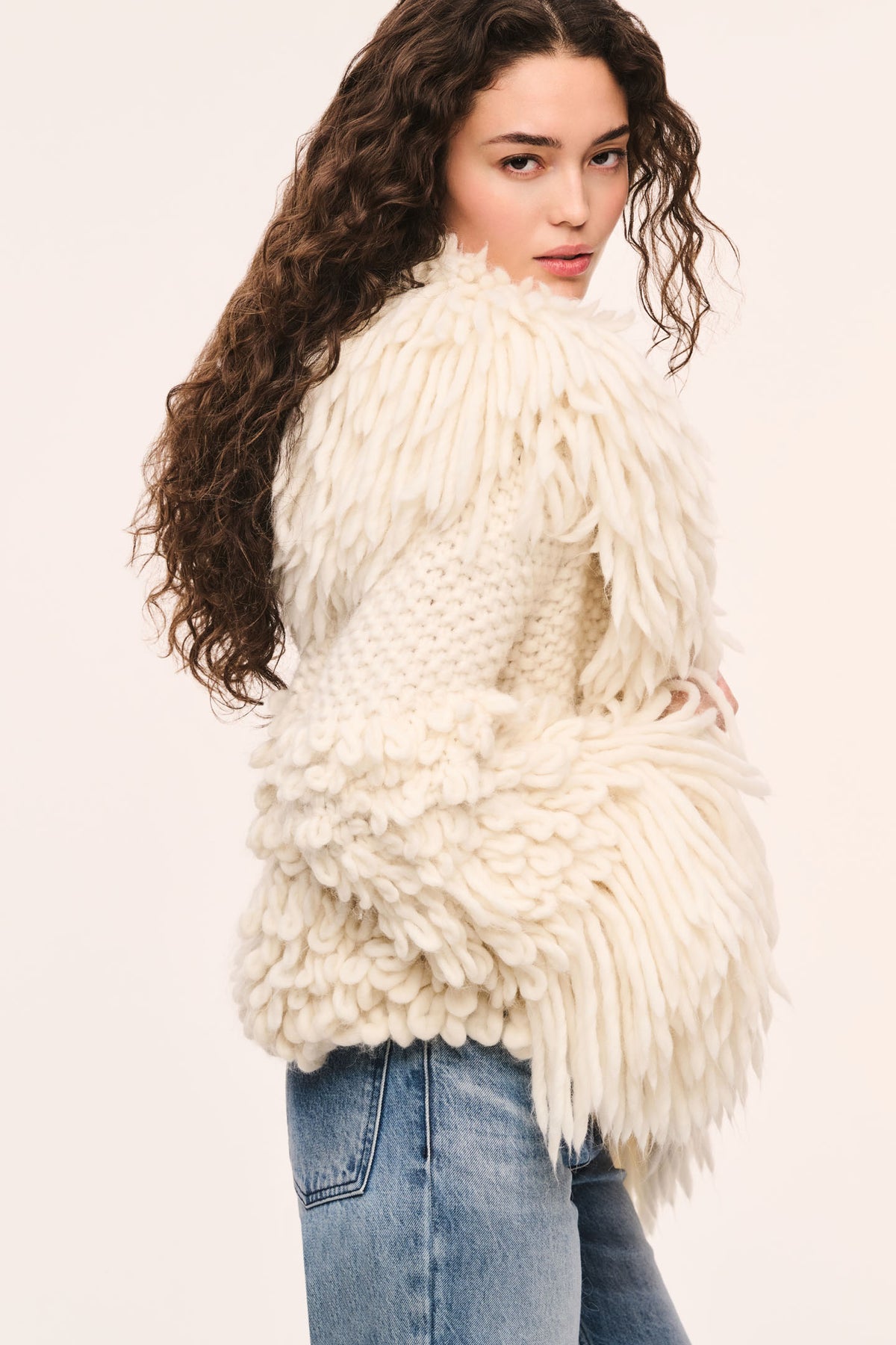 Ivory shag fringe jacket with layered cuffs and textured front panel detail