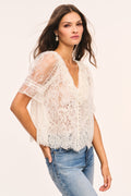 Alabaster sheer lace V-neck top with short sleeves and scalloped lace edges