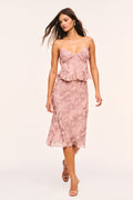 Pink snakeskin print midi skirt with ruffle hem and subtle fitted waist