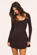 Dark brown pointelle mini dress with long sleeves and tiered ruffle hem, scoop neckline.