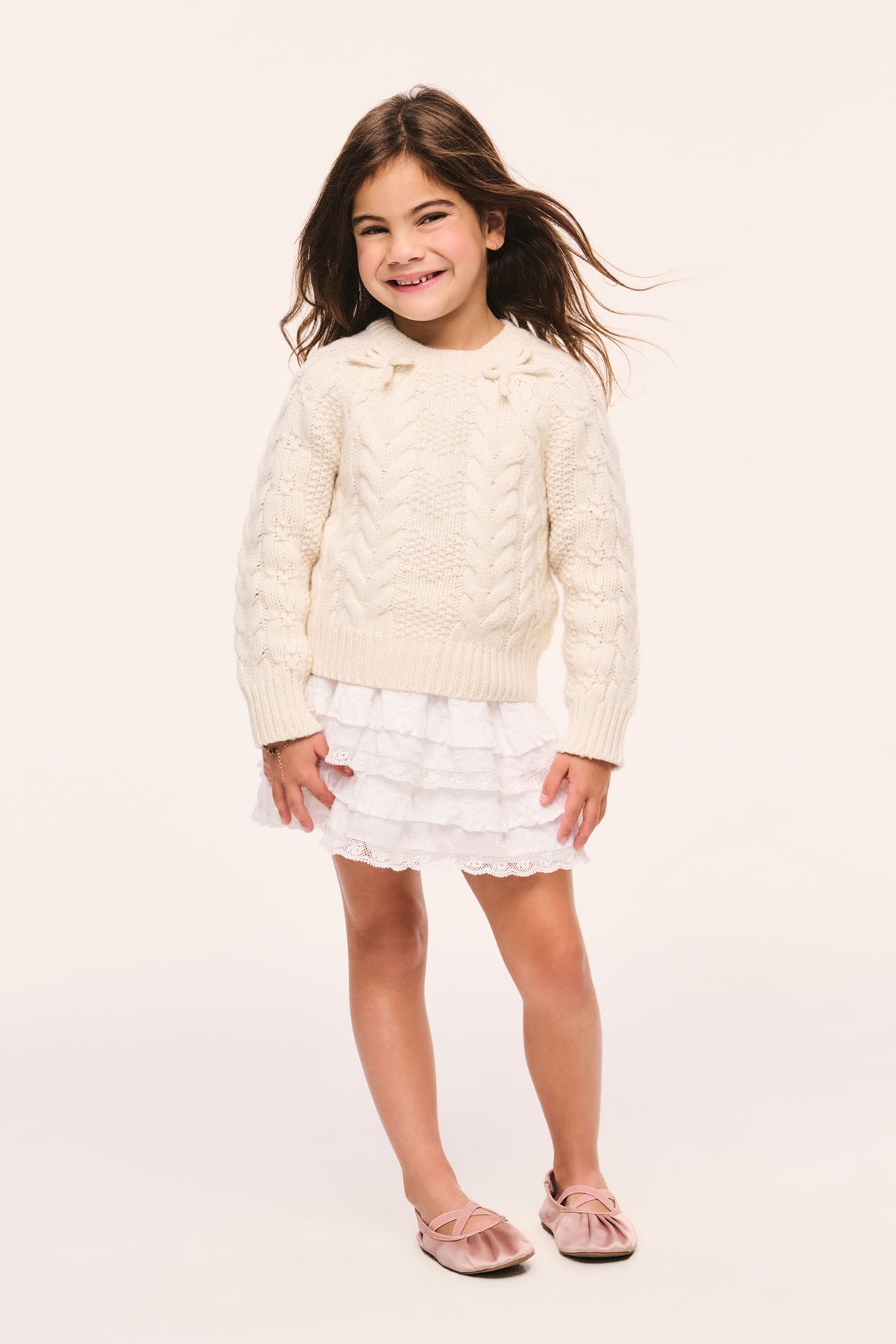 Girls' Mavita mini pullover sweater in cream, cable knit, long sleeves, crew neck and bow details at the neck