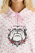 Pink floral-print hoodie with hood tie ribbon and bold Texas longhorn logo graphic