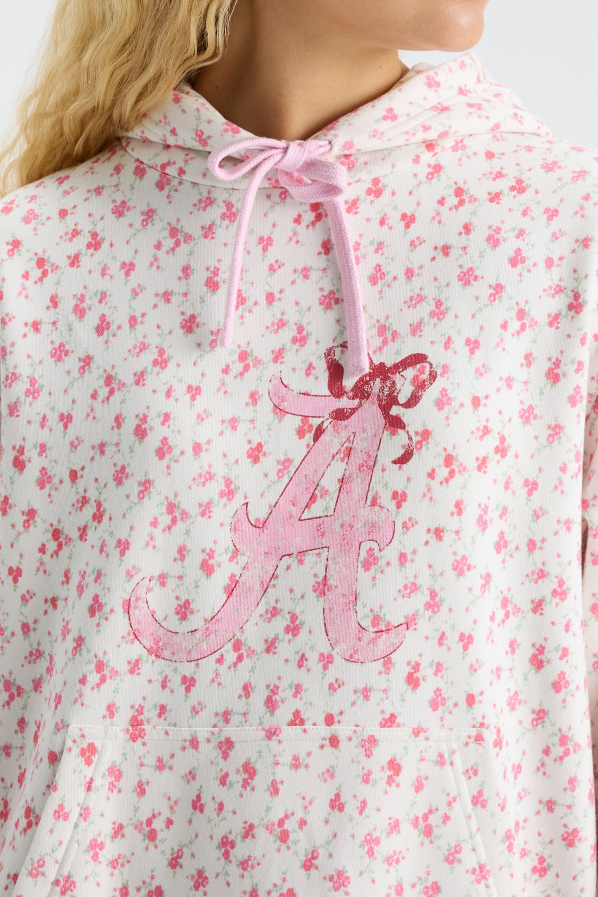 Pink floral hoodie close-up of hood and drawstring with front graphic print