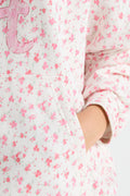 Pink floral hoodie sleeve and cuff detail with front kangaroo pocket seam
