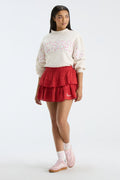 Cream sweatshirt with mock neck, long sleeves, and “FANATICS” floral graphic on front