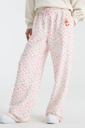 Pink ditsy floral sweatpants with elastic waist and pink drawstring, relaxed wide legs