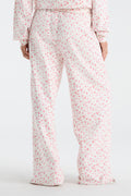 Cream floral sweatpants with elastic waist and wide straight legs