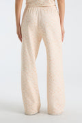 Womenโs wide-leg sweatpants with relaxed straight leg, elastic waistband, and pale floral print