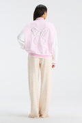 Fanatics x LoveShackFancy varsity jacket, pink and white back with bow graphic