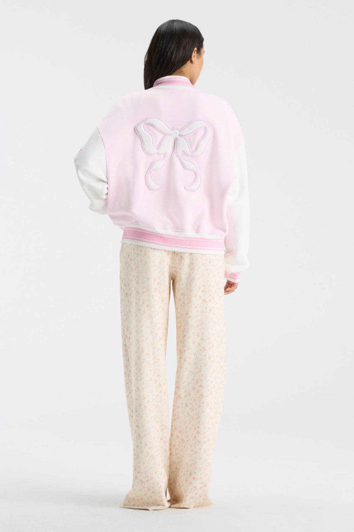 Fanatics x LoveShackFancy varsity jacket, pink and white back with bow graphic