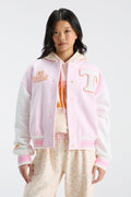 Pink varsity jacket with snap front, ribbed cuffs, and orange logo applique on right chest