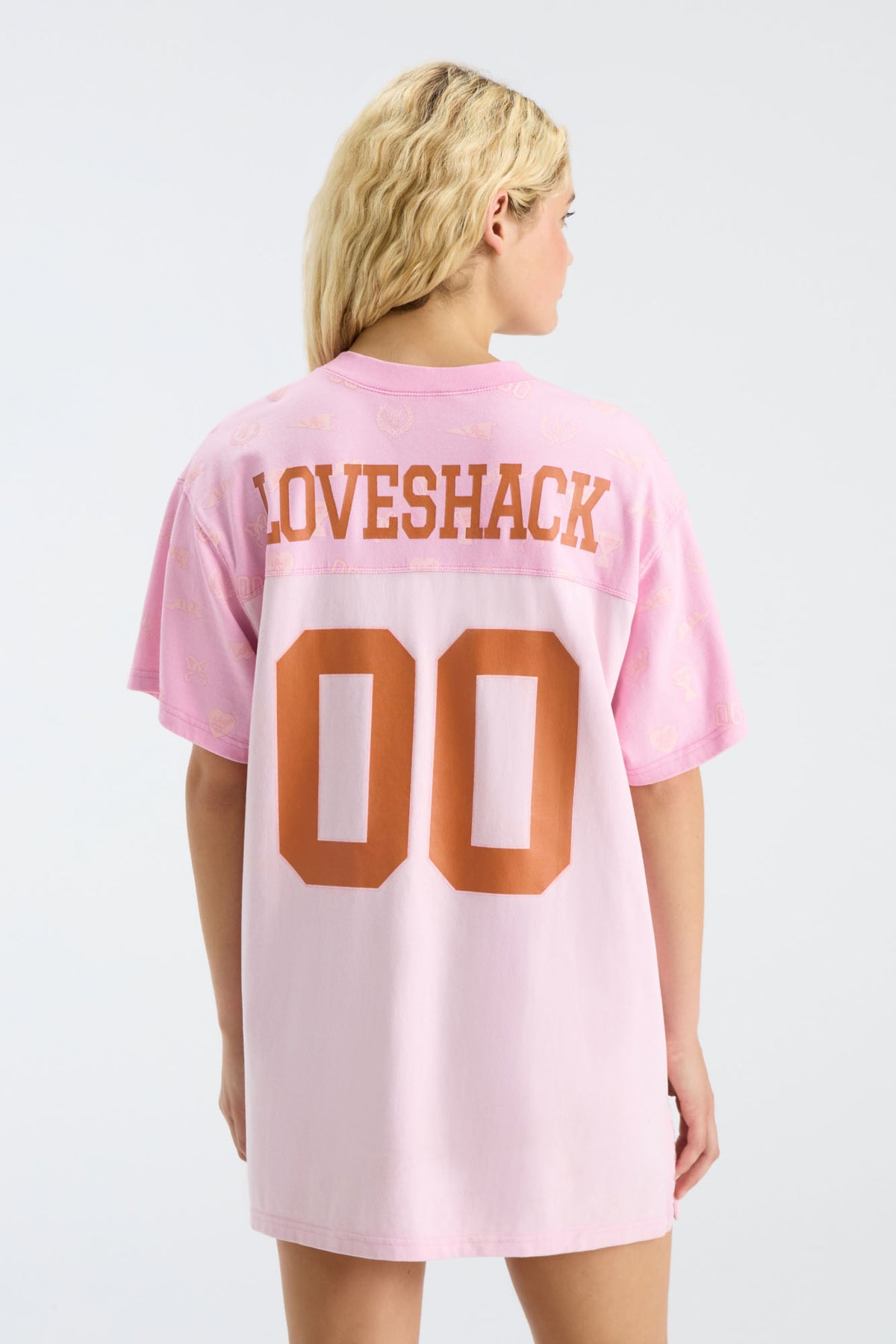 Pink jersey varsity crush dress with back LOVESHACK and 00 graphic, side view
