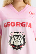 Pink jersey dress close-up of V-neck and Georgia bulldog graphic
