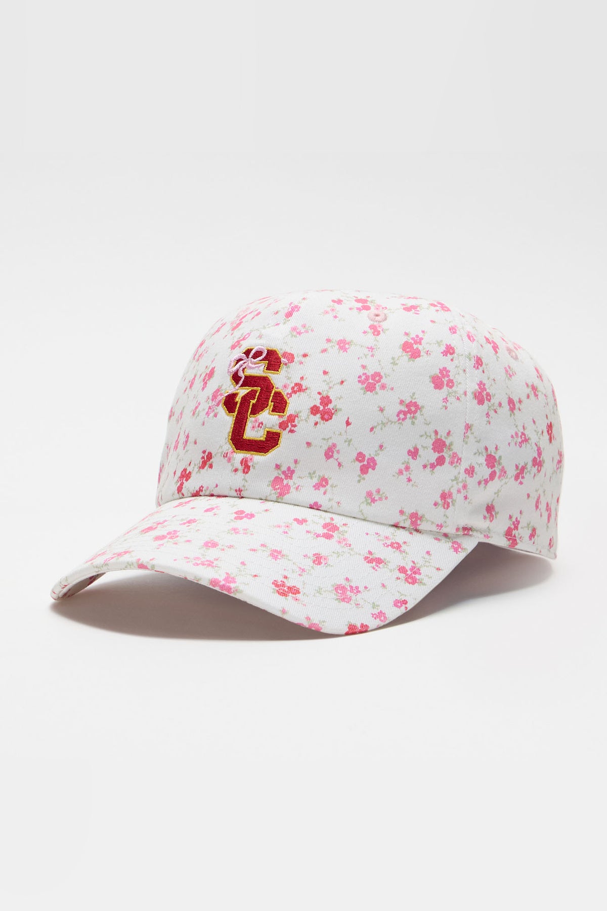 White floral baseball cap with red "S" logo