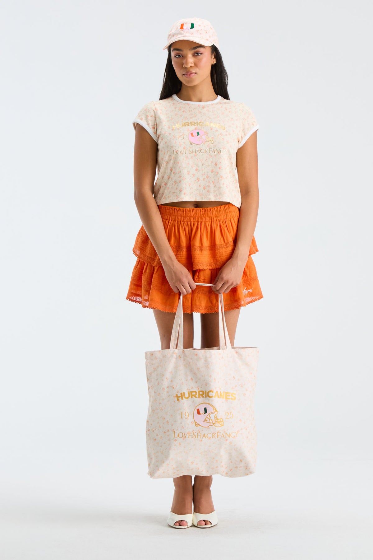 Light tan tote bag with Hurricanes lettering and football logo, long handles