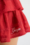 Deep red tiered ruffle mini skirt with lace hem and “Georgia” embroidery