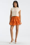 Cream floral ringer tee with white crew neck trim and small team logo