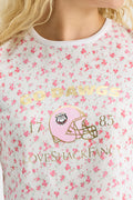 Fanatics x LoveShackFancy floral ringer tee close-up of football helmet graphic and "LOVE SHACK FANCY"