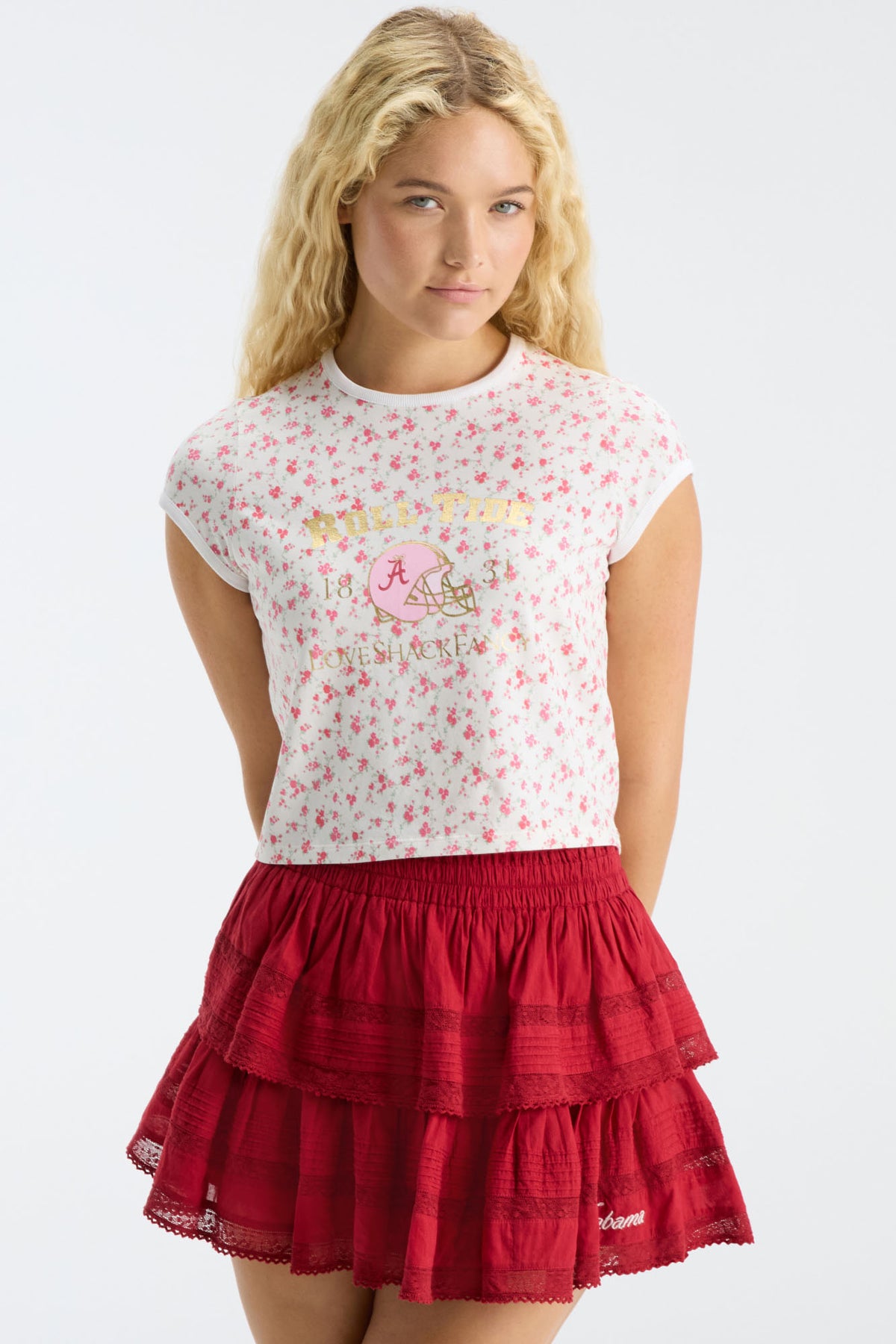 Cropped pink floral ringer tee with crew neck; model wears red tiered skirt