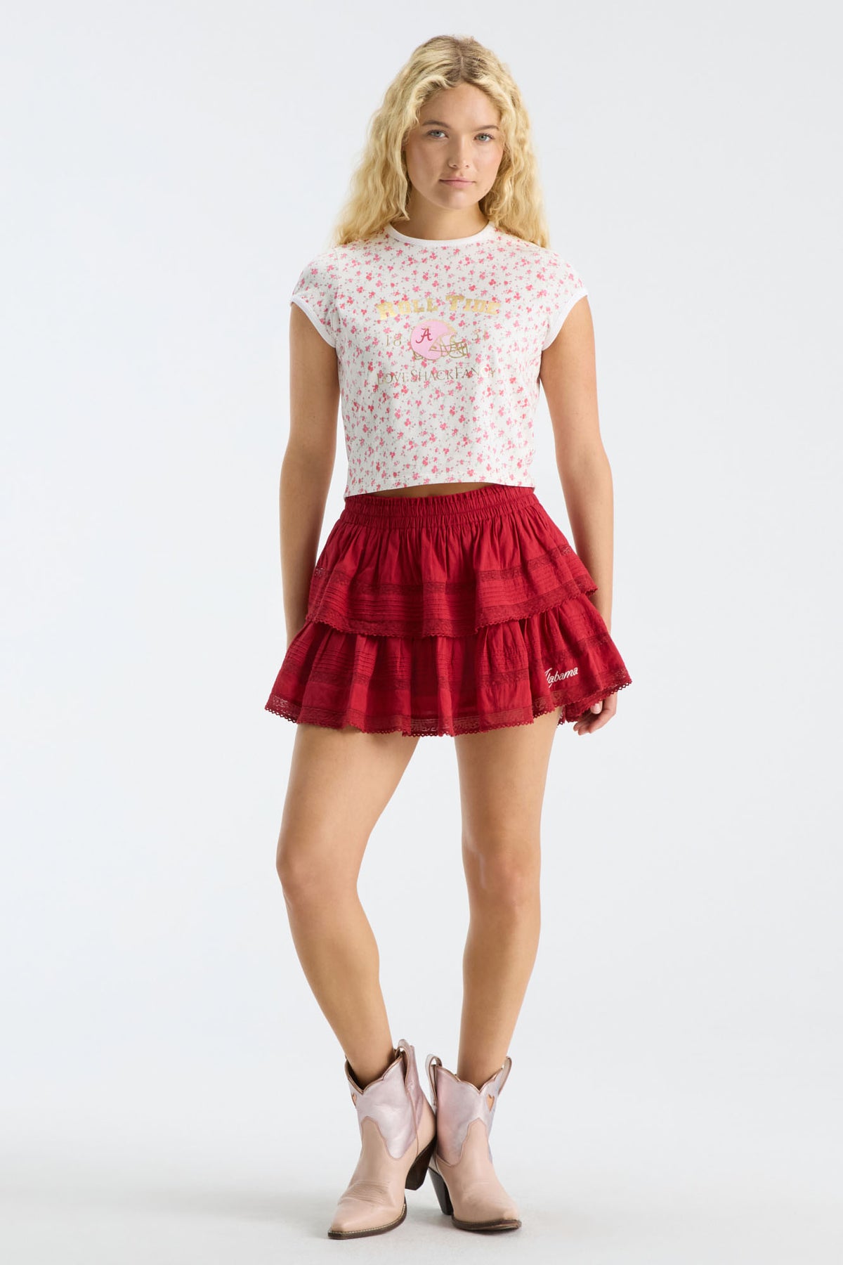 Cropped pink floral ringer tee with crew neck; model wears red tiered skirt