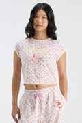 Pink floral ringer tee with front helmet graphic and crew neckline