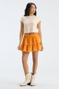 Bright orange tiered ruffle mini skirt with elastic waistband, knee-length coverage
