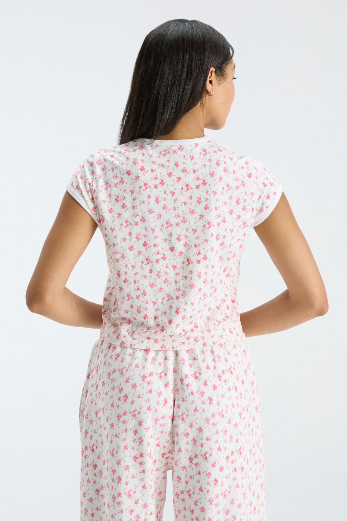 Cream floral ringer tee with white crew neck trim, back view