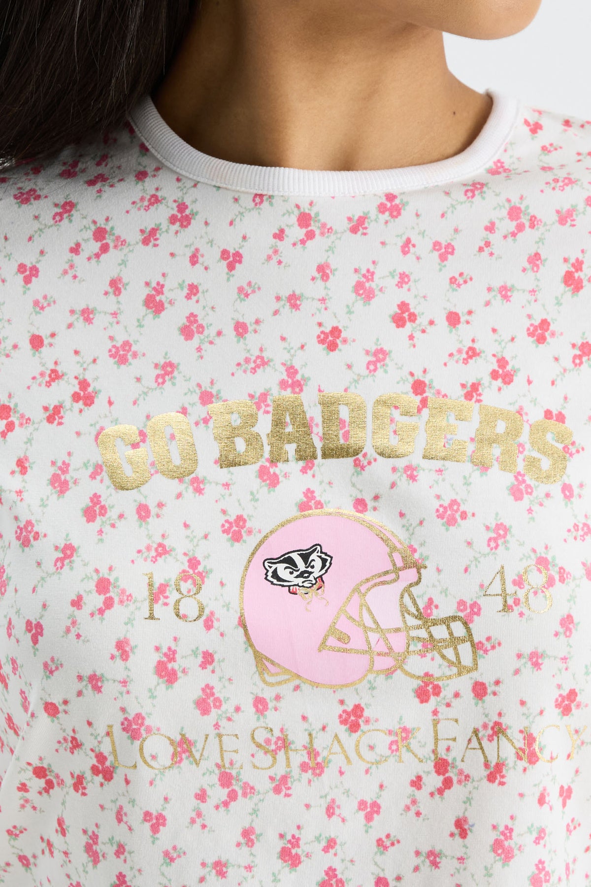 Cream floral ringer tee close-up with front graphic and printed text