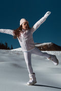 Girls alpine blue jersey pants with allover print, worn with hooded jacket and fitted cuffs