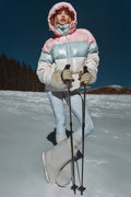 Hooded puffer jacket with faux-fur cuffs, pink and light blue color blocks, zip front.