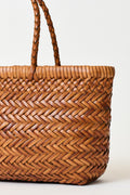 Mini woven tote bag with cognac braided handles and textured basket weave