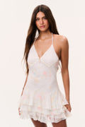 White halter mini dress in silk chiffon with pastel print and layered ruffle hem